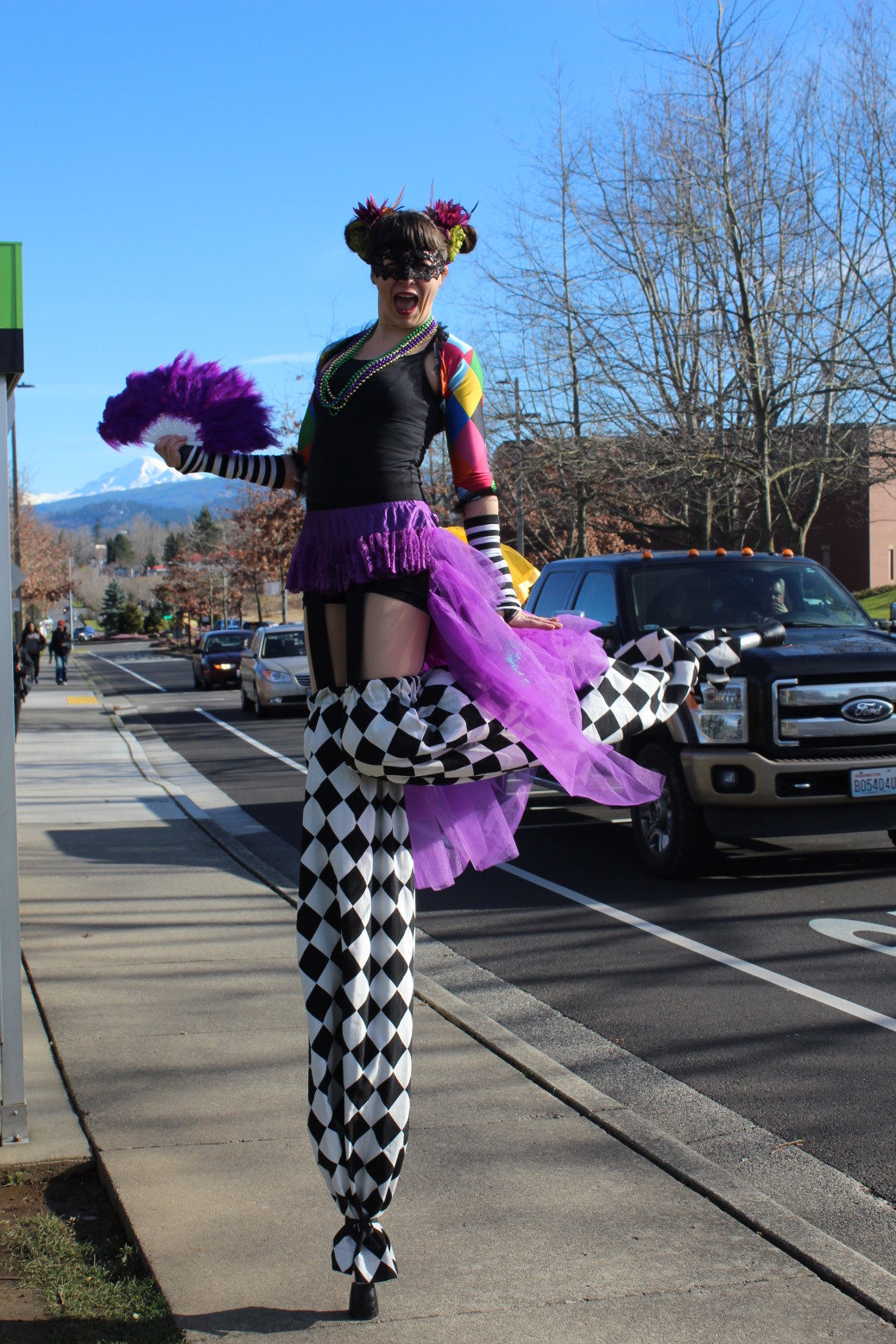 Heidi Sorgen prepares for the annual Mardi Gras festivities on her pair of stilts. Photo by Alex George