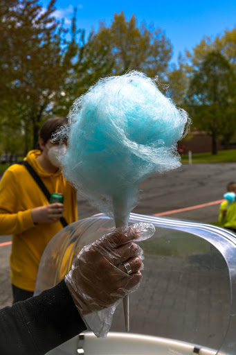 Organizers serve cotton candy at the Cascade Hall Fun O' Rama Throwdown